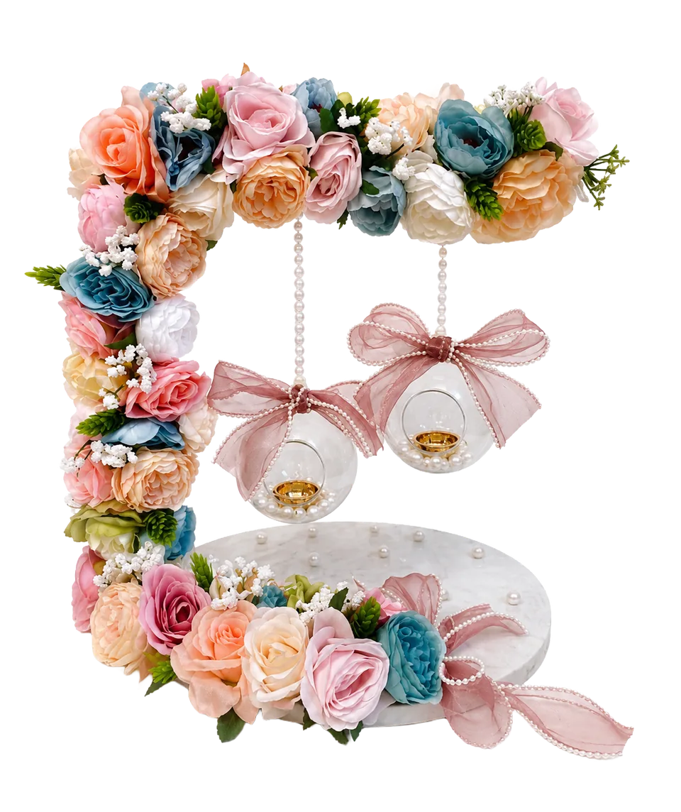 Pastel floral ring platter with hanging decorative spheres.